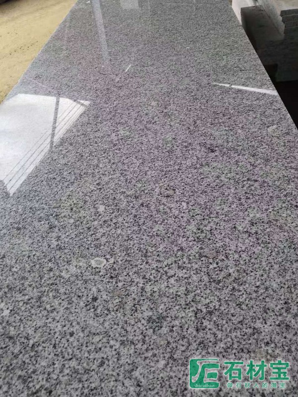 廉江芝麻白光面